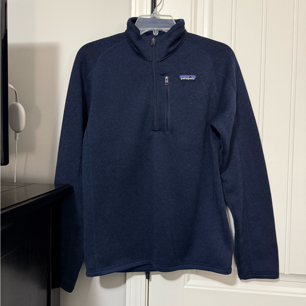 Patagonia dark blue quarter zip with a chest pocket. Size extra small.